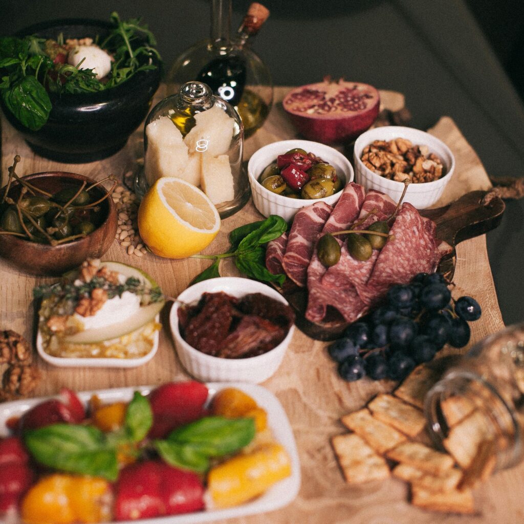pexels-photo-1813504-1813504 Delicious charcuterie board featuring fresh meats, cheeses, and fruits for a perfect dining experience.